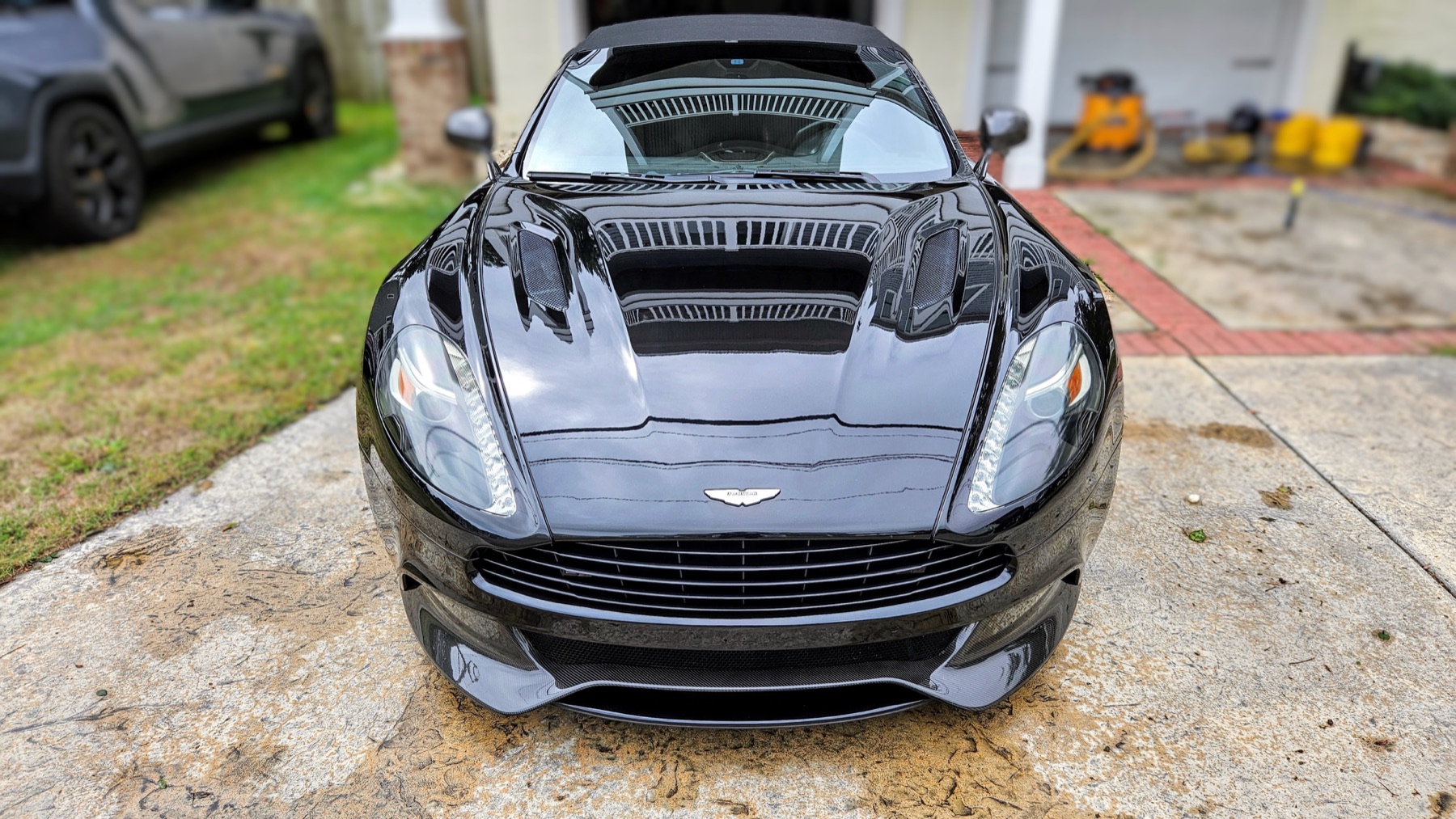 Black Aston Martin with a freshly detailed finish